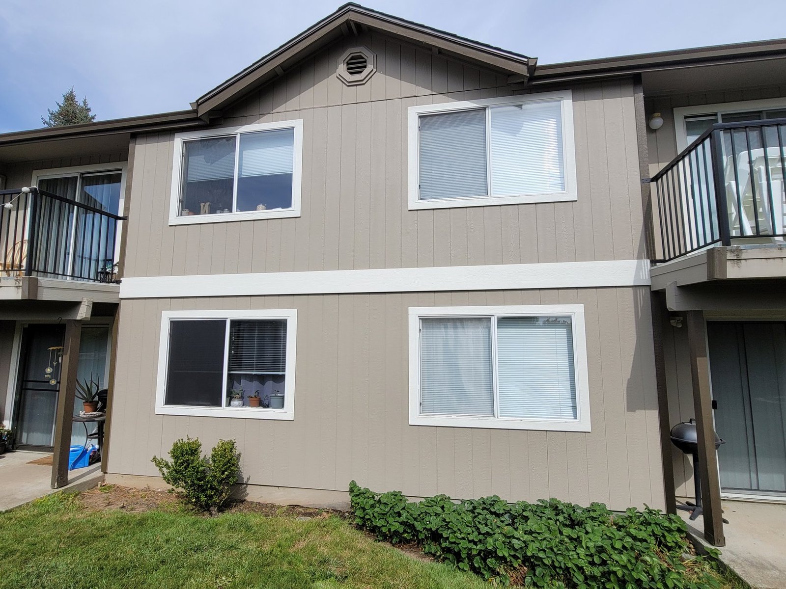 Two-story exterior with white window trim