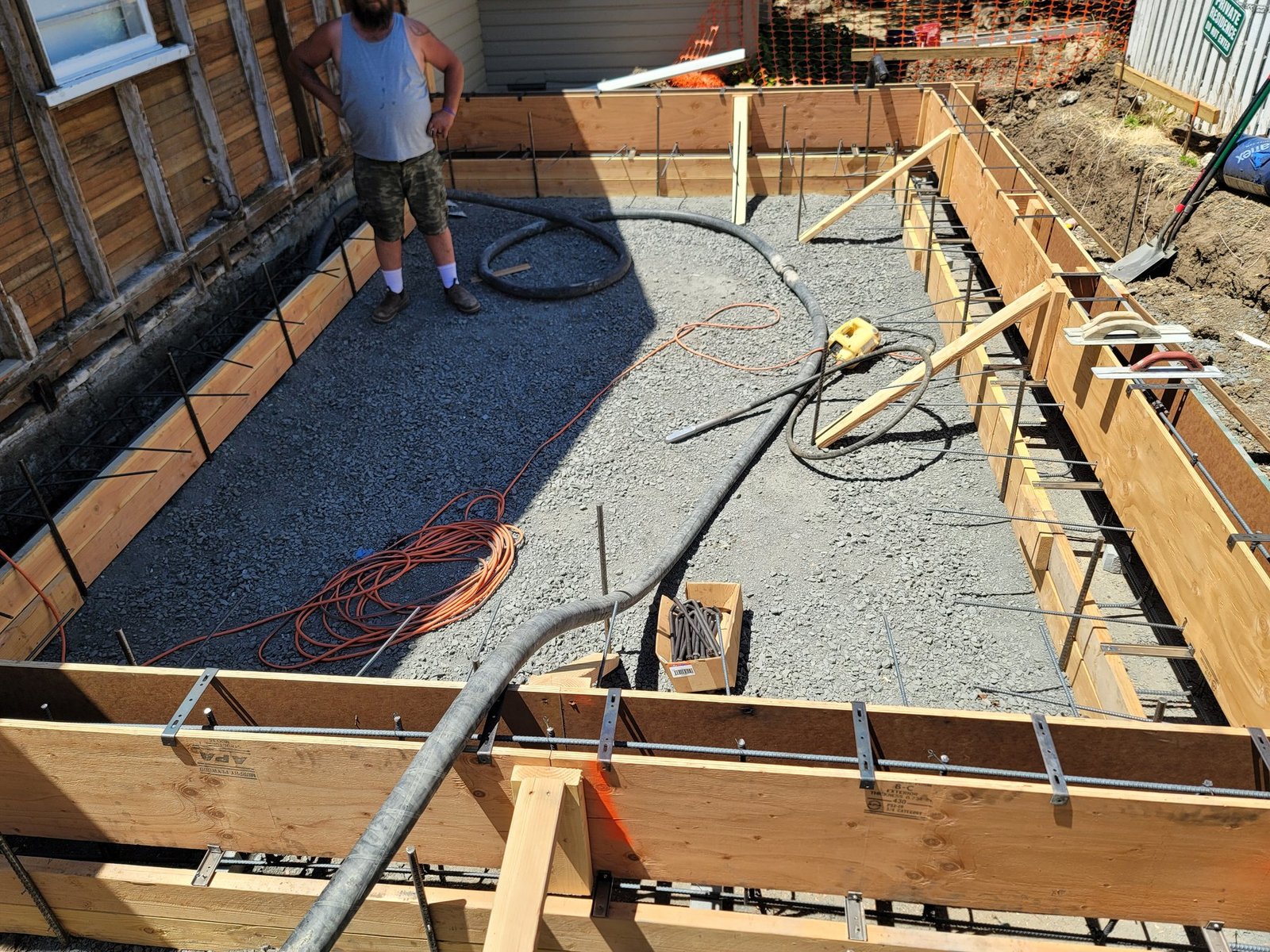 Concrete being placed inside foundation forms
