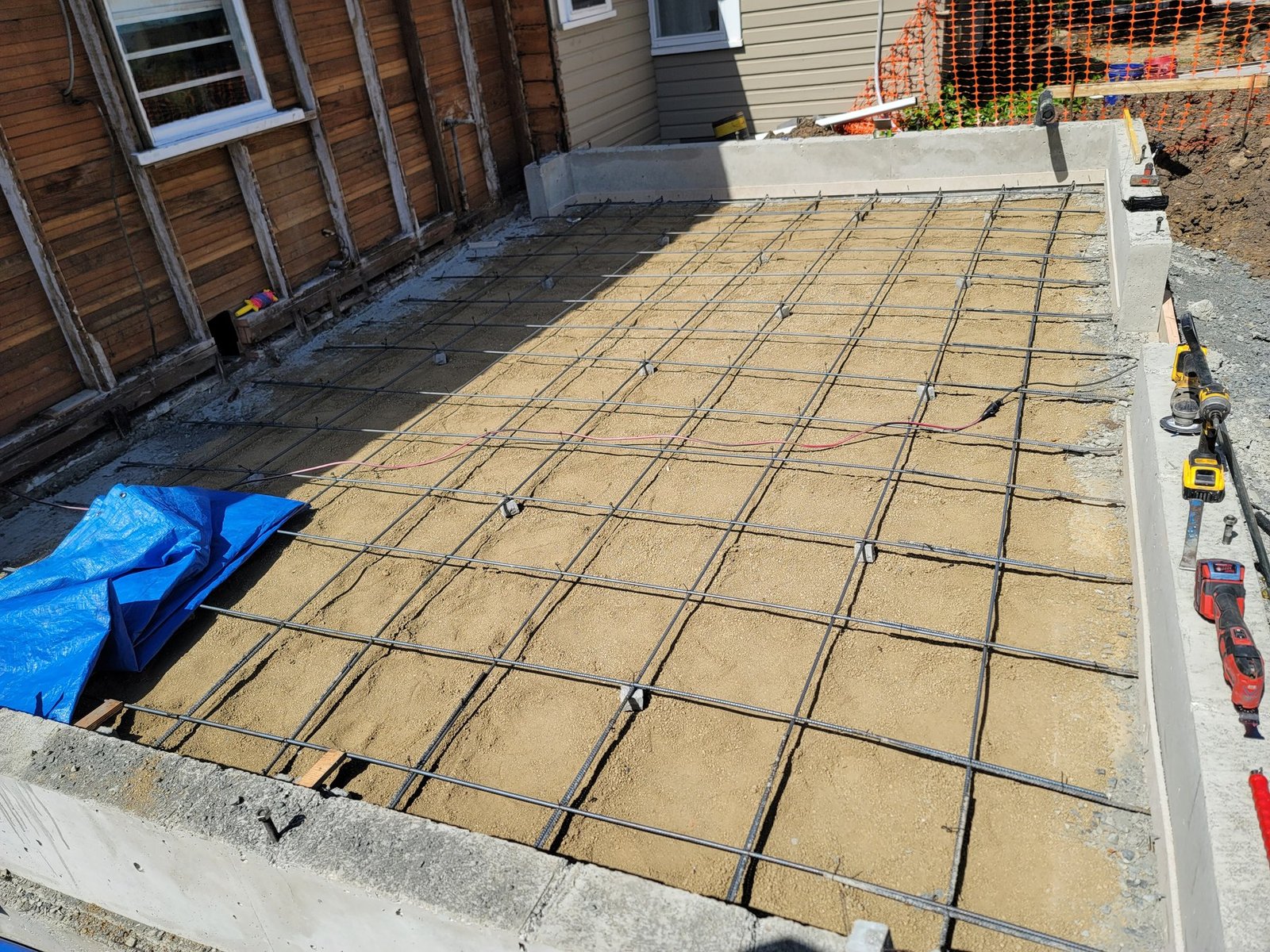 Reinforcement grid over a prepared concrete base