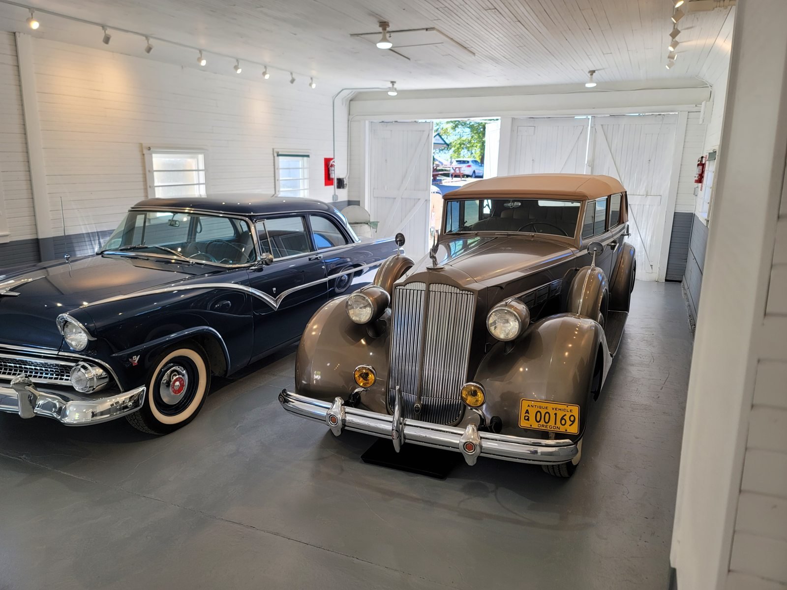 Garage interior with finished walls and classic cars