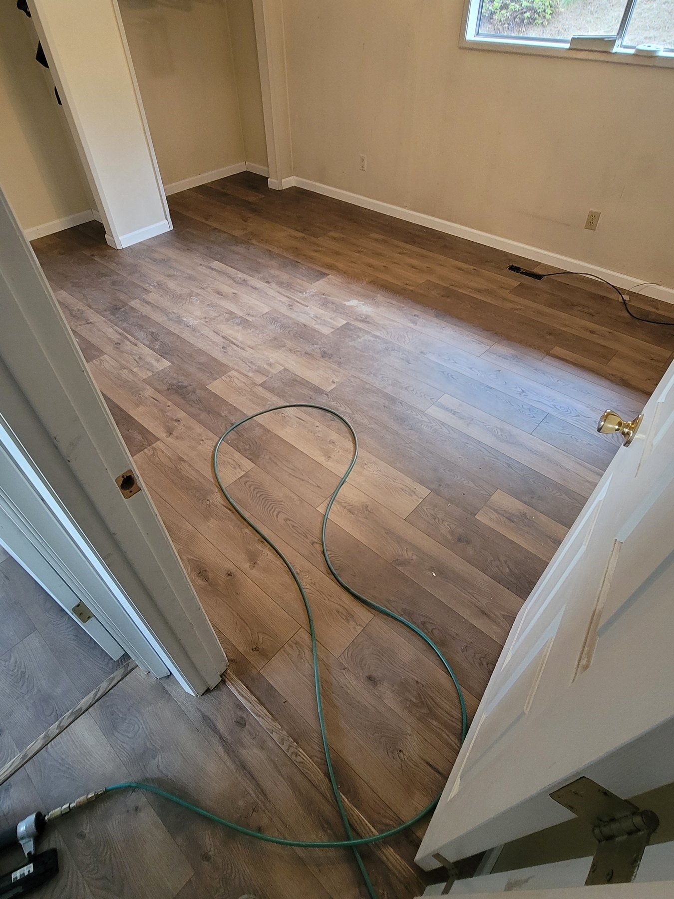 Wood-look flooring in a small room during installation