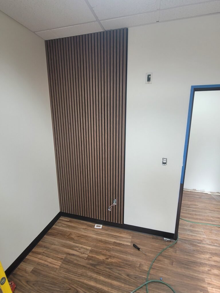 Vertical wood accent wall during interior finishing