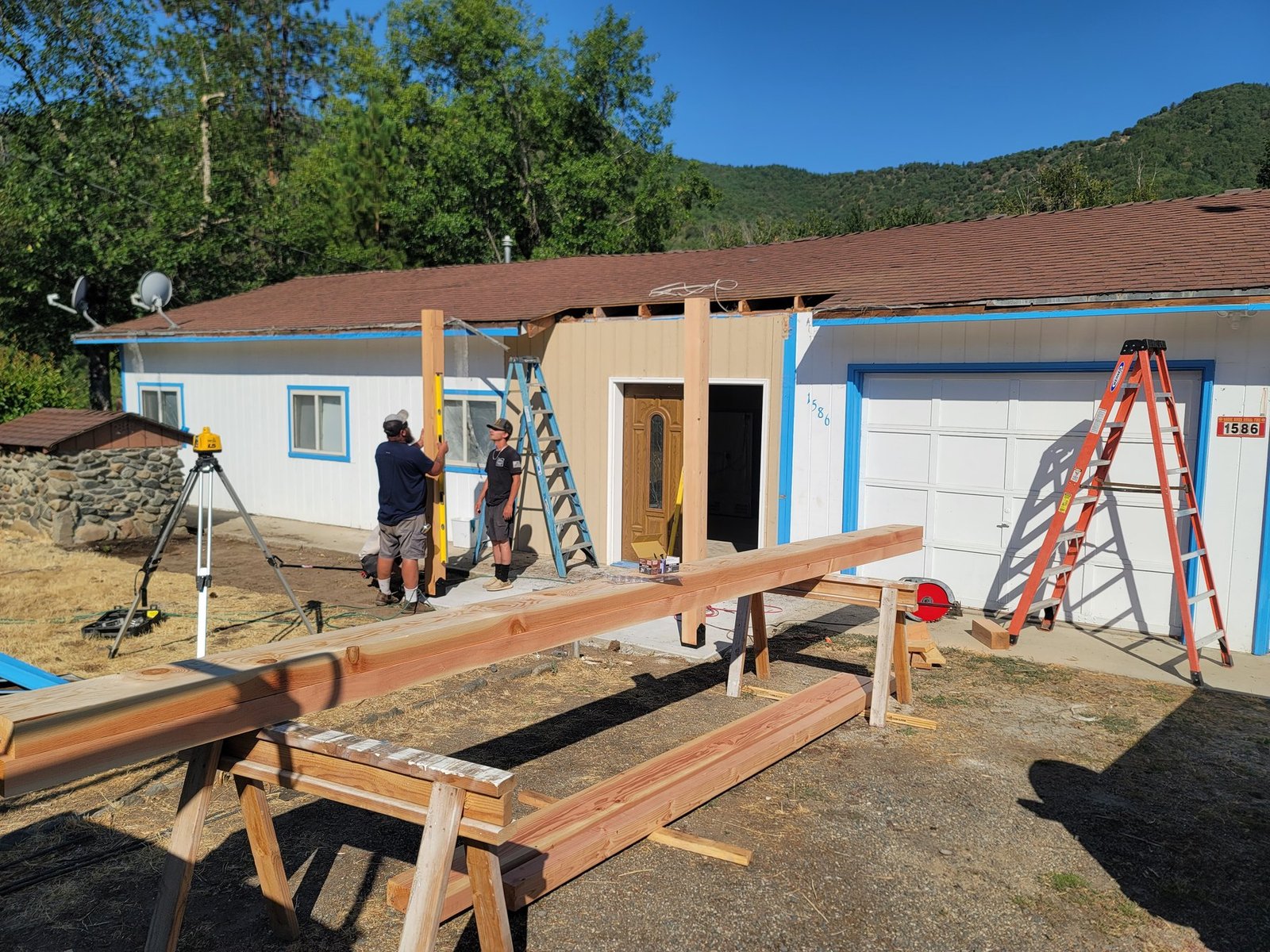 Timber posts being installed at a front entry