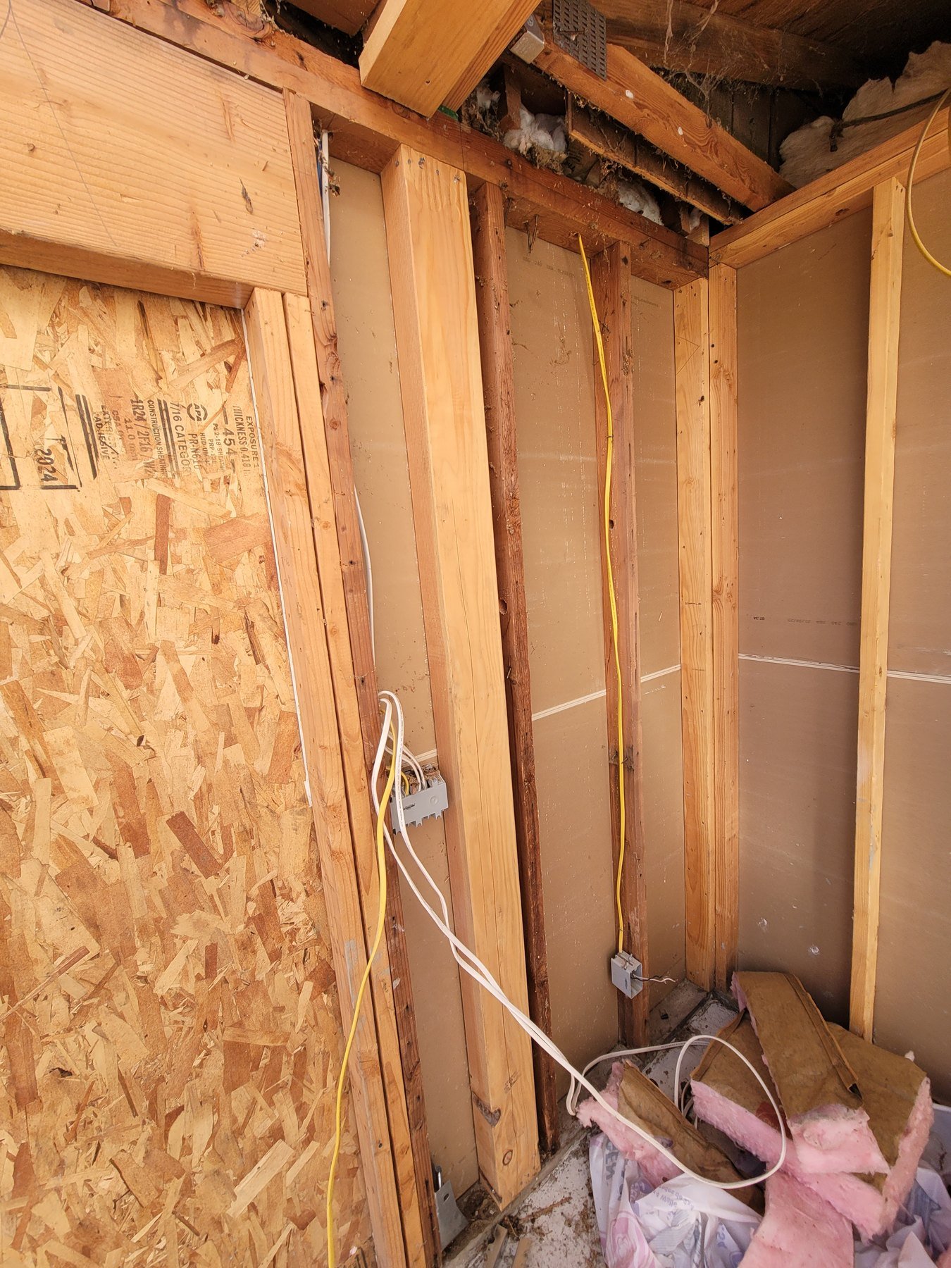 Exposed wall and roof framing during repair