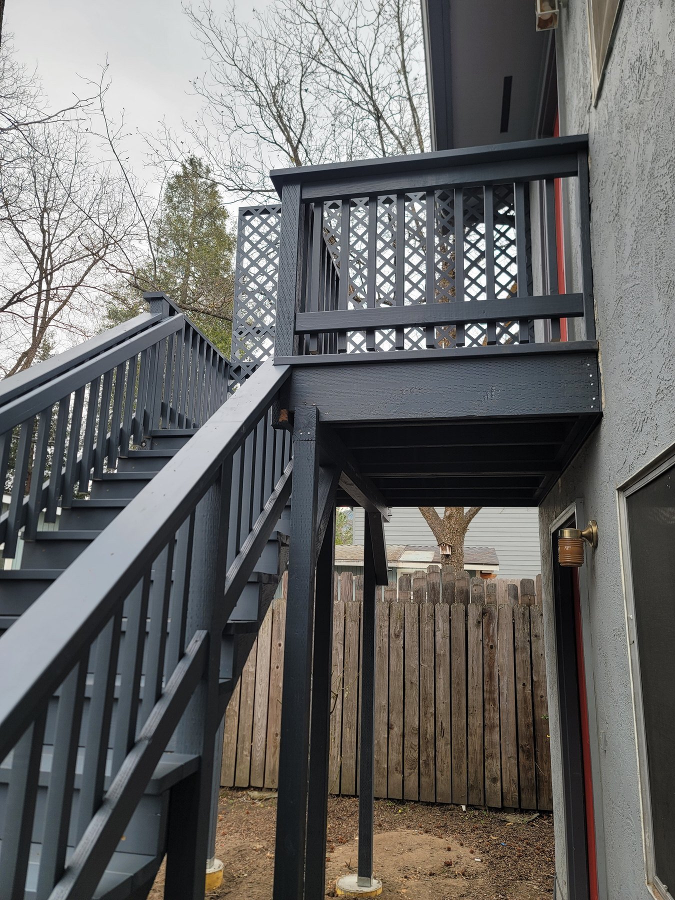 Elevated exterior landing with gray railings