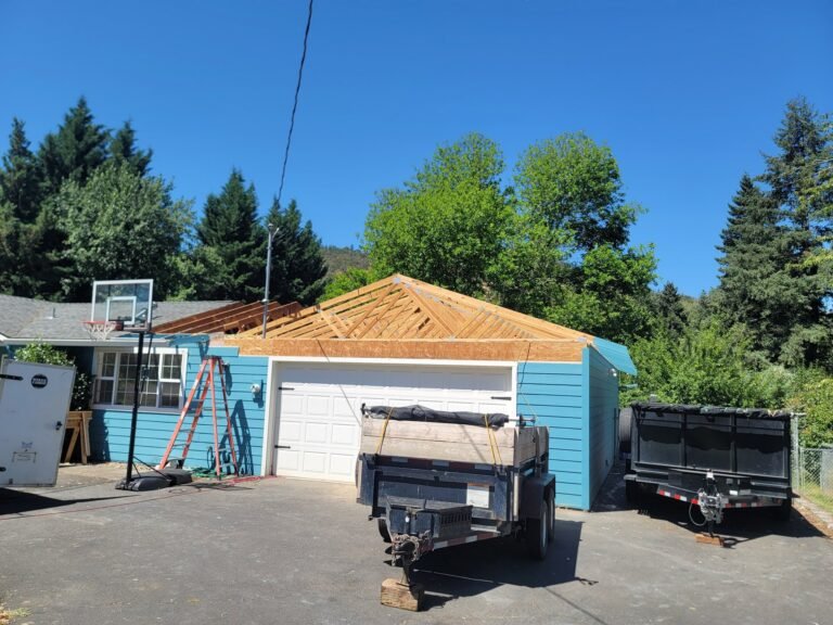 Garage exterior during roof framing work