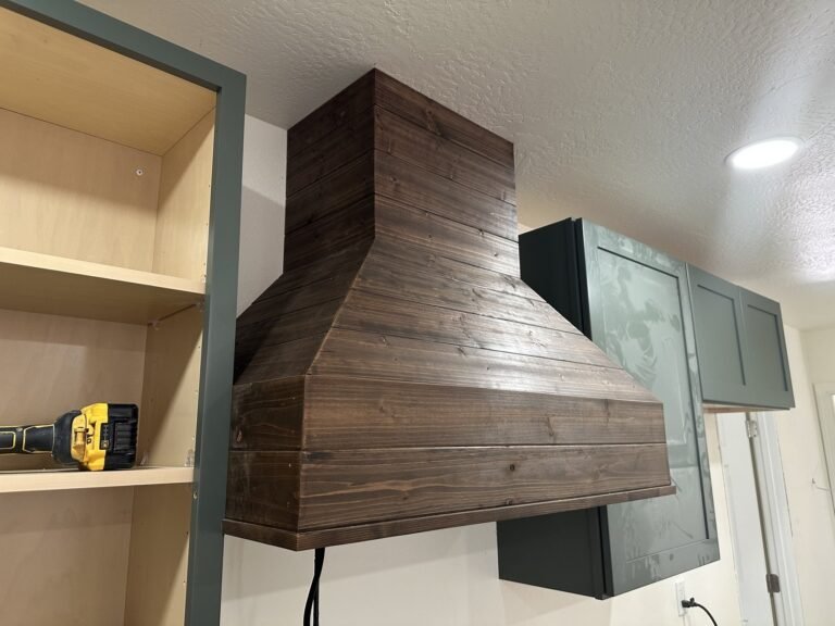 Wood range hood detail during kitchen installation